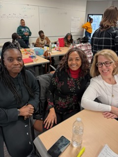 Regina Ross meeting with community members in a classroom