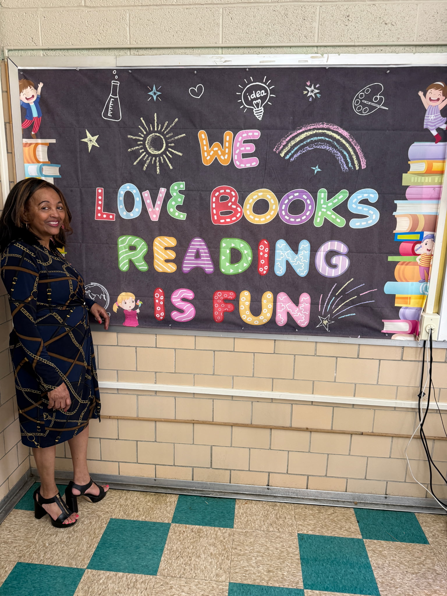 Regina Ross beside a reading display